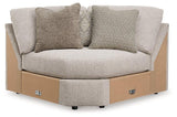 Ashley Furniture Ballyton sectional sofa with plush cushions and neutral fabric in a modern living room setting.