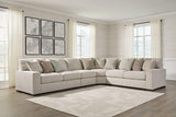 Ashley Furniture Ballyton sectional sofa with neutral fabric and plush cushions, shown in a spacious living room setting.