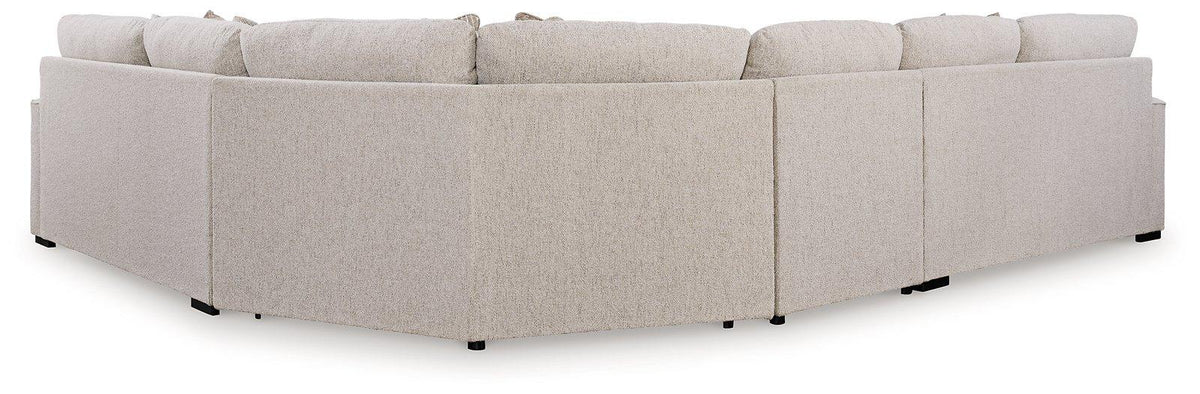 Ashley Furniture Ballyton Sectional sofa with plush cushions and modern design, shown in a spacious living room setting.