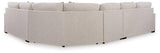 Ashley Furniture Ballyton Sectional sofa with plush cushions and modern design, shown in a spacious living room setting.