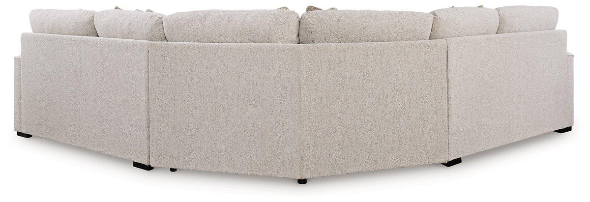 Ashley Furniture Ballyton sectional sofa with plush fabric cushions and modern design, shown in a spacious living room setting.