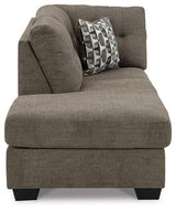 Ashley Mahoney 2-piece sleeper sectional with chaise, beige fabric, plush cushions, and modern design for comfortable seating.