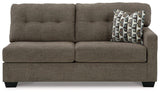 Ashley Furniture Mahoney 2-Piece Sleeper Sectional with Chaise showing plush fabric and modern design in a living room setting.