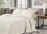 Ashley Furniture Mahoney 2-Piece Sleeper Sectional with Chaise, showing plush fabric and modern design in a living room setting.