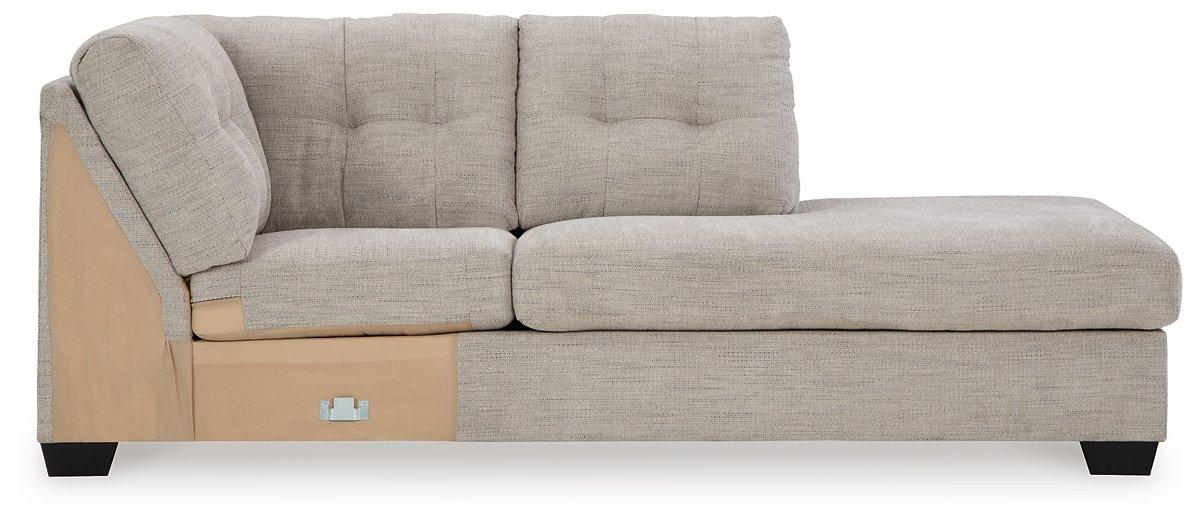Mahoney 2-piece sleeper sectional with chaise from Ashley Furniture, showing plush fabric, modern design, and comfortable seating arrangement.