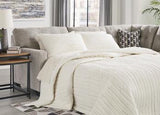 Ashley Mahoney 2-piece sleeper sectional with chaise, featuring plush upholstery and modern design, perfect for living room seating.