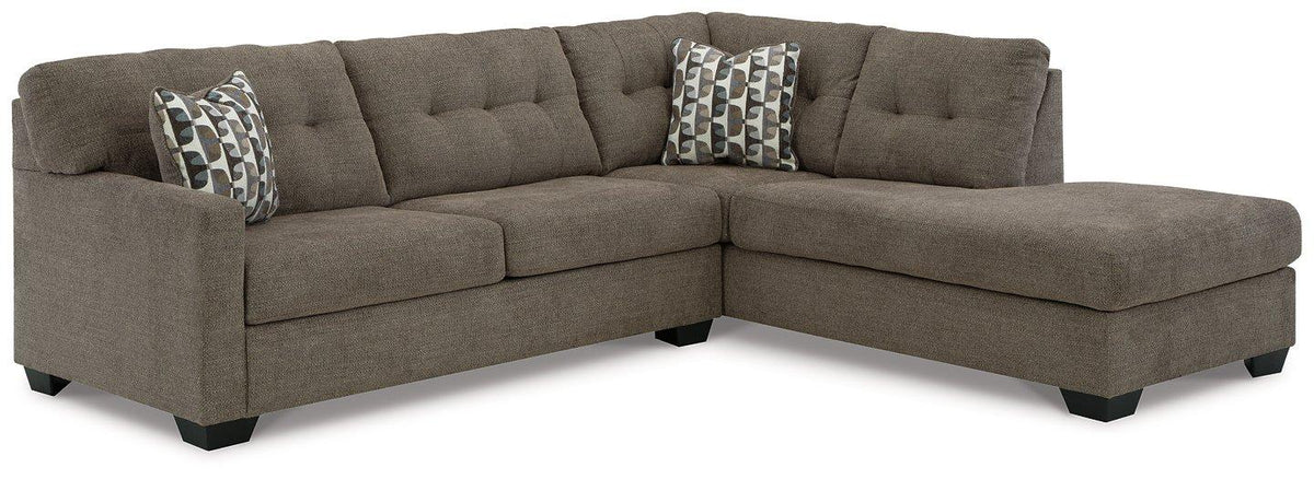 Ashley Furniture Mahoney 2-Piece Sleeper Sectional with Chaise, showing plush upholstery and modern design with chaise lounge.