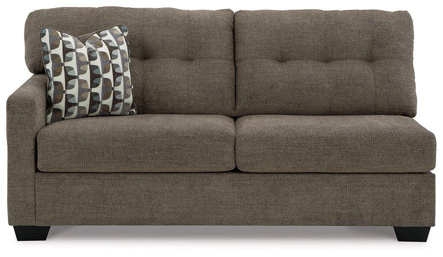 Ashley Mahoney 2-Piece Sleeper Sectional with Chaise, modern fabric sofa with chaise lounge and fold-out bed, in a stylish living room setting.
