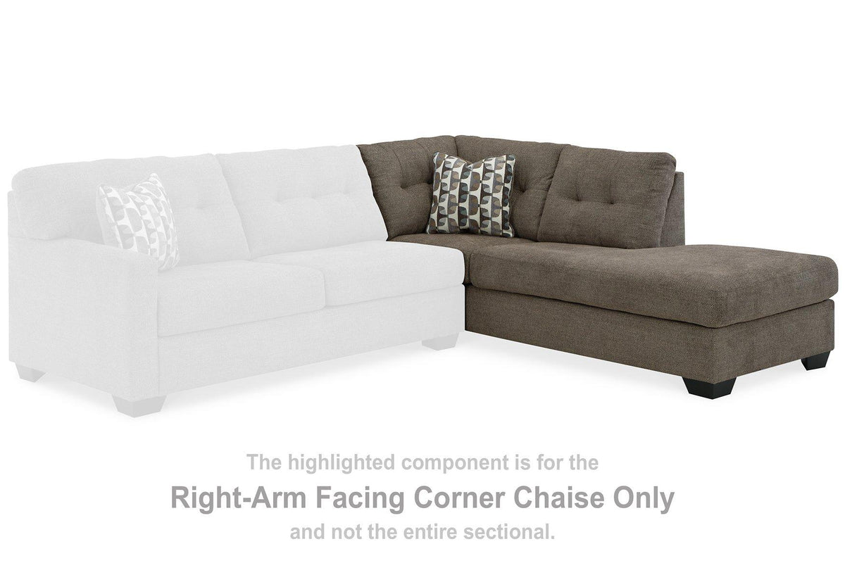 Ashley Mahoney 2-piece sleeper sectional with chaise, featuring plush fabric, modern design, and ample seating in a contemporary living room.