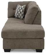 Ashley Furniture Mahoney 2-Piece Sleeper Sectional with chaise showing plush fabric and modern design in a living room setting.