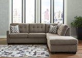 Ashley Furniture Mahoney 2-Piece Sleeper Sectional with Chaise, gray fabric with plush cushions and modern design.