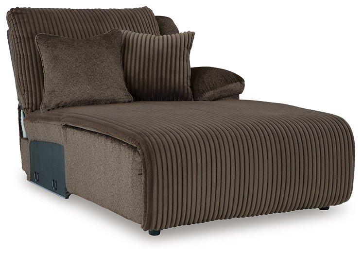 Ashley Furniture Top Tier reclining sectional sofa with chaise, showing plush cushions and modern design in a living room setting.