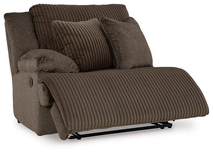 Ashley Furniture Top Tier reclining sectional sofa with chaise, showing plush upholstery and reclining seats in a modern living room setting.