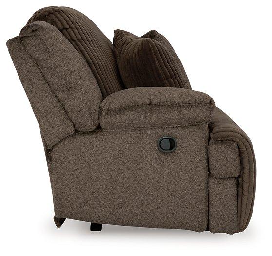 Ashley Furniture Top Tier reclining sectional sofa with chaise, featuring plush seating and modern design for comfortable relaxation.