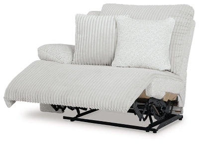 Ashley Furniture Top Tier reclining sectional sofa with chaise, featuring plush cushions and a modern design, viewed from an angled perspective.