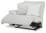 Ashley Furniture Top Tier reclining sectional sofa with chaise, featuring plush cushions and a modern design, viewed from an angled perspective.