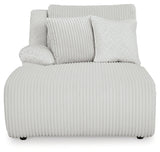 Ashley Furniture Top Tier reclining sectional sofa with chaise, showing plush cushions and dark fabric upholstery.