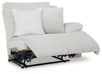Ashley Furniture Top Tier reclining sectional sofa with chaise, featuring plush cushions and a modern design, viewed from an angle.