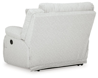 Ashley Furniture Top Tier reclining sectional sofa with chaise, featuring plush cushions and a comfortable reclining design.