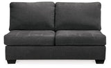 Ashley Furniture Ambee 3-piece sectional with chaise showing plush fabric and modern design in a spacious living room setting.