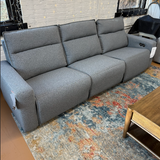 Ashley Furniture ModMax Power Reclining Sectional Sofa with plush cushions and modern design, ideal for comfortable living rooms.