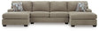 Ashley Furniture Newellen sectional with double chaise, showcasing plush upholstery and modern design in a spacious living room.