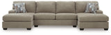Ashley Furniture Newellen sectional with double chaise, showcasing plush upholstery and modern design in a spacious living room.