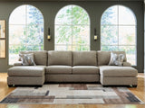 Ashley Furniture Newellen sectional with double chaise, shown in a cozy living room setting with plush fabric and modern design.