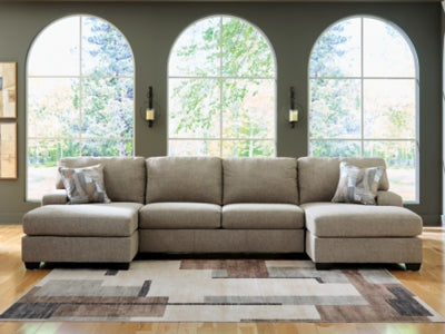 Ashley Furniture Newellen sectional with double chaise, shown in a cozy living room setting with plush fabric and modern design.