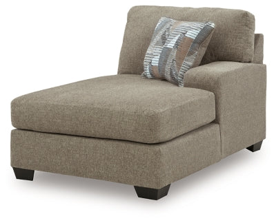 Ashley Furniture Newellen sectional with double chaise, showing a modern fabric sofa with multiple cushions and angled view.