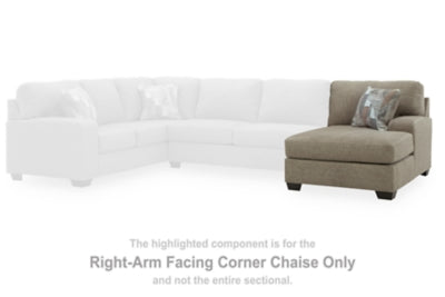 Ashley Furniture Newellen sectional with double chaise, showcasing plush fabric, wide seating, and modern design in a living room setting.