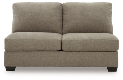 Ashley Furniture Newellen sectional with double chaise, featuring plush upholstered cushions and modern design in a living room setting.
