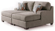 Ashley Furniture Newellen Super Chaise sectional with plush cushions and modern design, shown in a cozy living room setting.