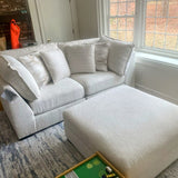 Ashley Furniture Pebblebrook 2-piece sectional sofa with plush cushions and modern design, shown in a cozy living room setting.