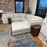 Ashley Furniture Pebblebrook 5-piece corner sectional with matching ottoman, featuring plush cushions and contemporary design.