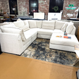 Ashley Furniture Pebblebrook 5-piece corner sectional with ottoman, featuring plush cushions and modern fabric upholstery.