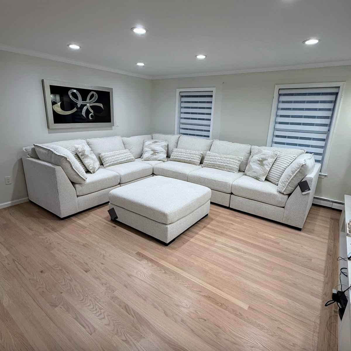 Ashley Furniture Pebblebrook 5-piece modular corner sectional with plush fabric and modern design, shown in a cozy living room setup.
