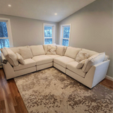 Ashley Furniture Pebblebrook 5-piece modular corner sectional showing plush fabric cushions and modern design in a home setting.