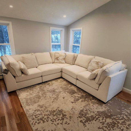 Ashley Furniture Pebblebrook 5-piece modular corner sectional showing plush fabric cushions and modern design in a home setting.