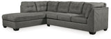 Ashley Furniture Pitkin 2-piece sectional with chaise, beige fabric, modern design, with cushions and wooden legs.