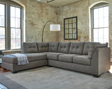 Ashley Pitkin 2-piece sectional with chaise, featuring plush upholstery and modern design, perfect for a stylish living room.