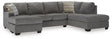 Ashley Furniture Riverfield sectional with chaise, showing a modern fabric sofa with a spacious chaise lounge, angled view.
