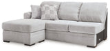 Ashley Furniture Gabyleigh sectional with chaise showing plush fabric upholstery and modern design in a well-lit living room setting.