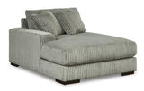 Ashley Furniture Lindyn sectional with chaise, showcasing a modern fabric sectional sofa with plush cushions and a spacious chaise lounge.