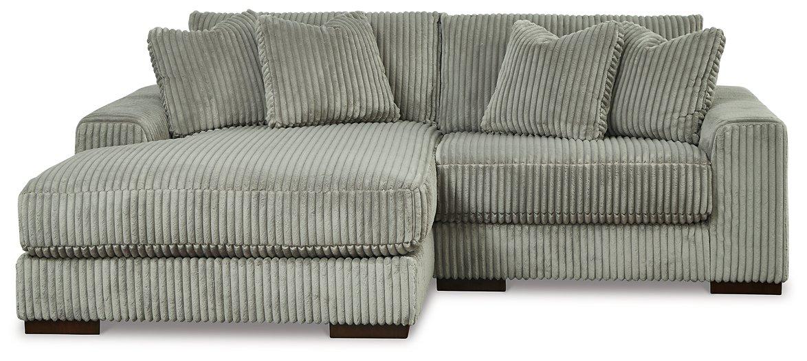 Ashley Furniture Lindyn sectional with chaise, featuring plush fabric upholstery and modern design for comfortable living space.