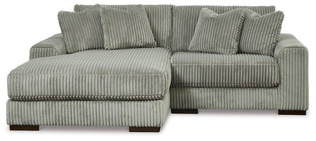 Ashley Furniture Lindyn sectional with chaise, featuring plush fabric upholstery and modern design for comfortable living space.