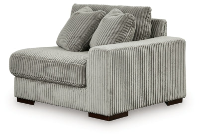 Ashley Furniture Lindyn sectional with chaise, showing a modern fabric sofa in a stylish living room setting.