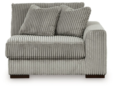 Ashley Furniture Lindyn sectional with chaise, showing a head-on view of the stylish, comfortable fabric sofa and chaise lounge.