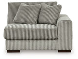 Ashley Furniture Lindyn sectional with chaise, showing a head-on view of the stylish, comfortable fabric sofa and chaise lounge.