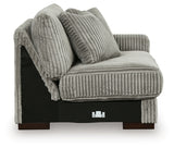 Ashley Furniture Lindyn sectional with chaise, featuring plush fabric and modern design, shown in a cozy living room setting.